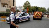 French police secure a street after a man killed two persons and injured an other in a knife attack in Trappes, near Paris, according to French authorities, France, August 23, 2018. (REUTERS/Philippe Wojazer)