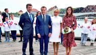 Danish Crown Prince Frederik of Denmark (L), Crown Princess Mary (R), French President Emmanuel Macron (2ndL) and his wife Brigitte Macron pose before heading to a farewell ceremony at the Royal Theatre on August 29, 2018 in Copenhagen. AFP / Ritzau Scanp