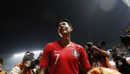 Son Heung Min of South Korea celebrates after winning the gold medal. REUTERS/Darren Whiteside
