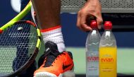 Rafael Nadal of Spain arranges his water bottles in his match against Nikoloz Basilashvili of Georgia during Day 7 of the 2018 US Open Men's Singles at the USTA Billie Jean King National Tennis Center in New York on September 2, 2018. AFP / Timothy A Clar