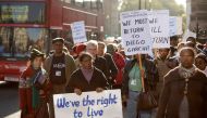 In this file photo taken on October 22, 2008 Chagos Islanders hold placards reading 