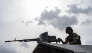 FILE PHOTO:  In this file photo taken on April 17, 2018 a member of the Nigerian Military Police sits on an armoured vehicle during the African Land Forces Summit (ALFS) military demonstration held at General Ao Azazi barracks in Gwagwalada. AFP / STEFAN 