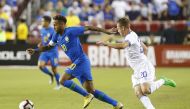  Brazil forward Neymar (10) dribbles the ball past El Salvador midfielder Fabricio Alfaro (20) in the first half during an international friendly soccer match at FedEx Field. Geoff Burke-USA TODAY Sports