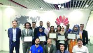 HBKU students with certificates after the internship program.