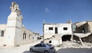 A Syrian motorist drives amidst ruins in Morek, a town in the northern countryside of Hama province that links regime-held areas to the south and rebel territory in neighbouring Idlib province to the north, on September 18, 2018. AFP / OMAR HAJ KADOUR
