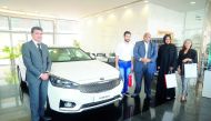 The handing over of the keys of the Kia Cadenza to the winner of the Fan Zone Raffle, Anas Alnemrat, at a ceremony held at the Al Sadd showroom of Kia Qatar. 