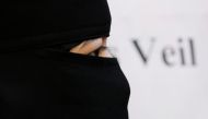 A burqa-wearing Muslim woman takes part in a demonstration outside the French Embassy in London, September 25, 2010. Reuters / Luke MacGregor