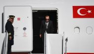 Turkish President Recep Tayyip Erdogan disembarks from his plane at Cologne's airport, on September 29, 2018 in Cologne, where he is to inaugurate the Central Mosque, one of Europe's largest.  AFP / Federico Gambarini
