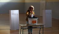 A woman casts her ballot for the referendum in Macedonia on changing the country's name that would open the way for it to join NATO and the European Union in Skopje, Macedonia September 30, 2018. REUTERS/Marko Djurica