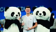 Bernard Tomic of Australia celebrates after winning the men's singles final against Fabio Fognini of Italy at the ATP Chengdu Open tennis tournament in Chengdu, in China's southwest Sichuan province on September 30, 2018. China OUT
/ AFP 
