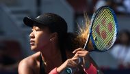Naomi Osaka of Japan hits a return during her women's singles third round match against Julia Goerges of Germany at the China Open tennis tournament in Beijing on October 4, 2018. / AFP / GREG BAKER