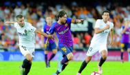 Barcelona's Lionel Messi in action with Valencia's Jose Gaya. Reuters/Heino Kalis