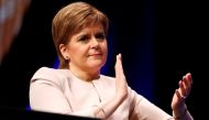 Scotland's First Minister Nicola Sturgeon listens to Plaid Cymru's leader Adam Price speak at the Scottish National Party's party's conference in Glasgow, Scotland, Britain, October 8, 2018. REUTERS/Russell Cheyne