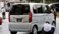 A man takes a look at Honda Motor's N Box car at its showroom in Tokyo, Japan, October 4, 2017. Picture taken October 4, 2017. REUTERS/Kim Kyung-Hoon