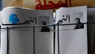 Blank copies of Lebanon's leading newspaper An-Nahar are displayed on a newspaper stand outside a bookstore in the coastal Lebanese port city of Byblos, north of Beirut, on October 11, 2018. AFP / JOSEPH EID
