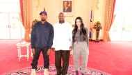 Rapper Kanye West (L) and Kim Kardashian (R) pose for a photograph with Uganda's President Yoweri Museveni when they paid a courtesy call at State House, Entebbe, Uganda October 15, 2018. Presidential Press Unit/Handout via REUTERS 