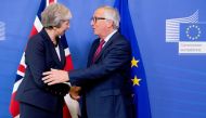  British Prime Minister Theresa May (L) and President of the European Commission Jean-Claude Juncker (R) shake hands during their meeting in Brussels, Belgium on October 17, 2018. (Dursun Aydemir - Anadolu Agency)