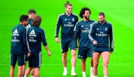 Real Madrid's French forward Karim Benzema (R), Real Madrid's Brazilian defender Marcelo (2R), Real Madrid's Welsh forward Gareth Bale (C) and teammates attend a training session at the Valdebebas training ground in Madrid on October 19, 2018.  AFP / Gabr