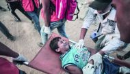 A wounded Palestinian child is being evacuated from the site after Israeli soldiers' intervention during the 