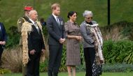 Britain's Prince Harry (2nd L) and his wife Meghan (2nd R), the Duchess of Sussex, watch a traditional warrior challenge with Maori elders during an official welcoming ceremony at Government House in Wellington on October 28, 2018. / AFP / Marty MELVILLE