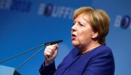 FILE PHOTO: German Chancellor Angela Merkel speaks during her Christian Democratic Union (CDU) party colleague and Hesse State Prime Minister Volker Bouffier's campaign rally for the upcoming state election Dieburg, Germany, October 23, 2018. REUTERS/Ralp