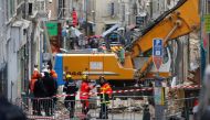 French rescue workers and emergency services work near the rubble of two dilapidated buildings that collapsed this week in the city of Marseille, France, November 7, 2018. REUTERS/Jean-Paul Pelissier 