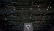 A Tesla sign is seen during the China International Import Expo (CIIE), at the National Exhibition and Convention Center in Shanghai, China November 6, 2018. REUTERS/Aly Song