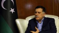 Libya's unity government Prime Minister Fayez al-Sarraj speaks during an interview with AFP in the capital Tripoli on November 8, 2018. / AFP / Mahmud TURKIA 