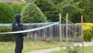 An Australian police officer stands outside a property that was searched by Australian counter-terrorism investigators, located in the Melbourne suburb of Werribee, Australia, November 10, 2018. AAP/James Ross/via REUTERS