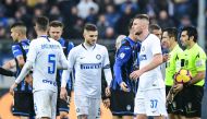 Inter Milan's Argentine forward Mauro Icardi (C) and Inter Milan's Slovak defender Milan Skriniar (R) react at the end of the Italian Serie A football match Atalanta Bergamo v Inter Milan at the Atleti Azzuri d'Italia stadium on November 11, 2018 in Berga