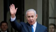 Israeli Prime Minister Benjamin Netanyahu waves as he arrives at the Elysee Palace after the commemoration ceremony for Armistice Day, 100 years after the end of World War One, in Paris, France, November 11, 2018. Reuters/Reinhard Krause