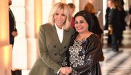French President's wife Brigitte Macron (L) and Niger's President's wife Lalla Malika Issoufou pose during a spousal event at the Chateau de Versailles (Palace of Versailles) in Versailles, outside Paris, on November 11, 2018 as part of commemorations mar