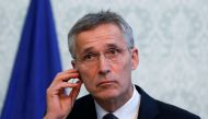 NATO Secretary General Jens Stoltenberg adjusts his earphone during a joint news conference with Afghanistan's President Ashraf Ghani (unseen) in Kabul, Afghanistan November 6, 2018. REUTERS/Mohammad Ismail