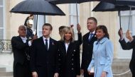 French President Emmanuel Macron (L) and his wife Brigitte Macron welcome Romania's President Klaus Werner Iohannis and his wife Carmen Iohannis at the Elysee Palace in Paris on November 11, 2018 AFP / Jacques Demarthon 