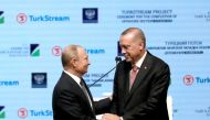 Turkish President Recep Tayyip Erdogan (R) shakes hands with Russian President Vladimir Putin (L) as they attend a ceremony commemorating completion of sea section works for TurkStream natural gas project on November 19, 2018 at Istanbul Congress Center (