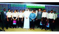 Cadets from Qatar Leadership Academy (QLA), pose for a group photo during their visit to Qatar Stock Exchange.