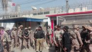 Pakistani security personnel stand outside the Chinese consulate after an attack in Karachi on November 23, 2018.  / AFP / ASIF HASSAN 