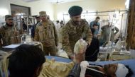 A Pakistani army soldier distributes drinks to suicide blast victims in a hospital in Kohat on November 23, 2018. AFP / Abdul Majeed
