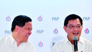 Singapore's Finance Minister Heng Swee Keat (R) speaks as Trade and Industry Minister Chan Chun Sing smiles during a press conference by ruling People Action Party (PAP) in Singapore on November 23, 2018.  AFP /Ariffin Jamar/The Straits Times”  
