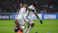 Manchester City's Spanish midfielder David Silva (C) vies with Lyon's French midfielder Tanguy Ndombele (R) and Lyon's forward Houssem Aouar (L) during the UEFA Champions League Group F football match between Olympique Lyonnais and Manchester City at the 