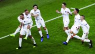Paris Saint-Germain's Brazilian forward Neymar celebrates with Paris Saint-Germain's French forward Kylian Mbappe and teammates after scoring a goal during the UEFA Champions League Group C football match between Paris Saint-Germain (PSG) and Liverpool FC