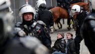 Police arrest protesters wearing yellow vests, a symbol of a drivers' protest against higher fuel prices, during a demonstration in central Brussels, Belgium, November 30, 2018. Reuters/Yves Herman