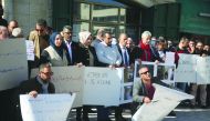 Palestinians stage a protest against Israeli raid on the main office of the official news agency Wafa in Ramallah, West Bank, yesterday.