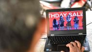 A man watches a commercial featuring K-pop supergroup Blackpink on his laptop in Jakarta on December 12, 2018, after the advertisement was banned by the Indonesian Broadcasting Commission. AFP / Bay ISMOYO