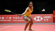Sindhu Pusarla of India hits a return against Ratchanok Intanon of Thailand during their women's singles semi-final match at the 2018 BWF World Tour Finals badminton competition in Guangzhou in southern China's Guangdong province on December 15, 2018. Chi
