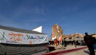 A picture taken on December 16, 2018, shows people attending the placing of the cornerstone ceremony for the rebuilding of the Great Mosque of Al-Nuri and 