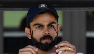 India's captain Virat Kohli (C) sits on the players bench at the end of second Test cricket match between Australia and India in Perth on December 18, 2018. / AFP / WILLIAM WEST / 