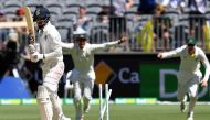 India's batsman Lokesh Rahul (L) is clean bowled by Australia's paceman Mitchell Starc during day four of the second Test cricket match between Australia and India in Perth on December 17, 2018. (AFP / WILLIAM WEST)