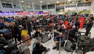 Passengers wait around in the South Terminal building at Gatwick Airport after drones flying illegally over the airfield forced the closure of the airport, in Gatwick, Britain, December 20, 2018. REUTERS/Peter Nicholls