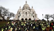 Yellow vest protestors go down the Montmartre Hill in Paris, on December 22, 2018, as demonstrations are announced in several regions of France.  AFP / Sameer Al-Doumy